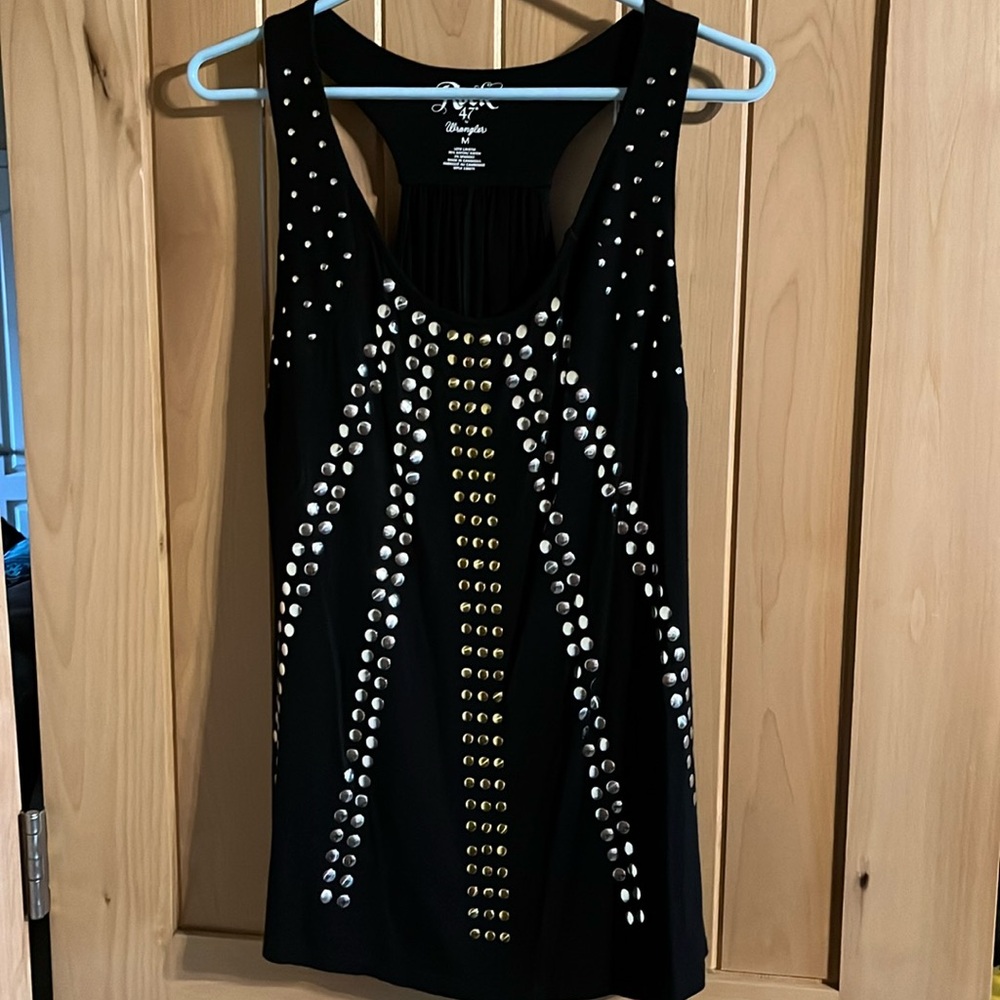 Black tank with silver and gold circle details.